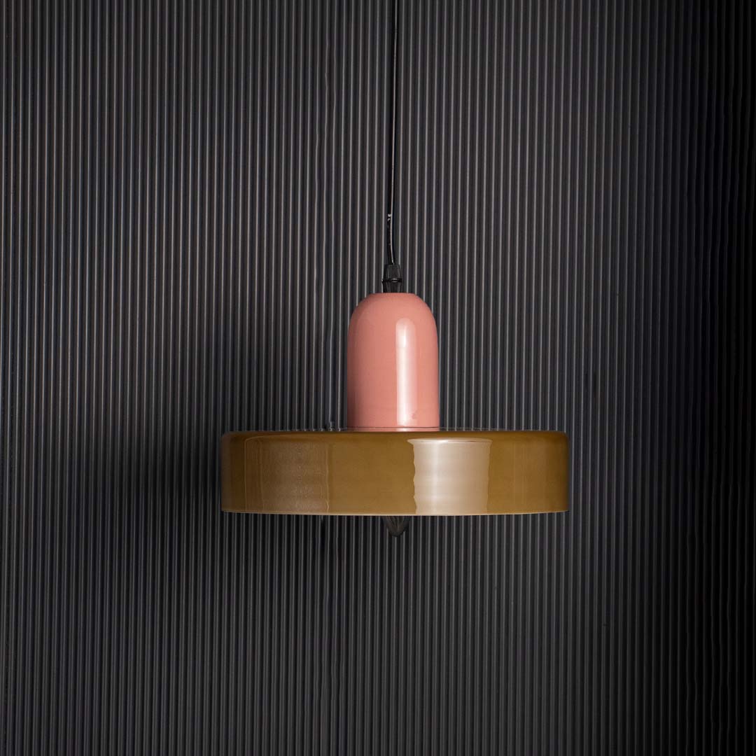 Pink and olive green pendant ceiling light with round design displayed stylishly against black background for modern interiors.