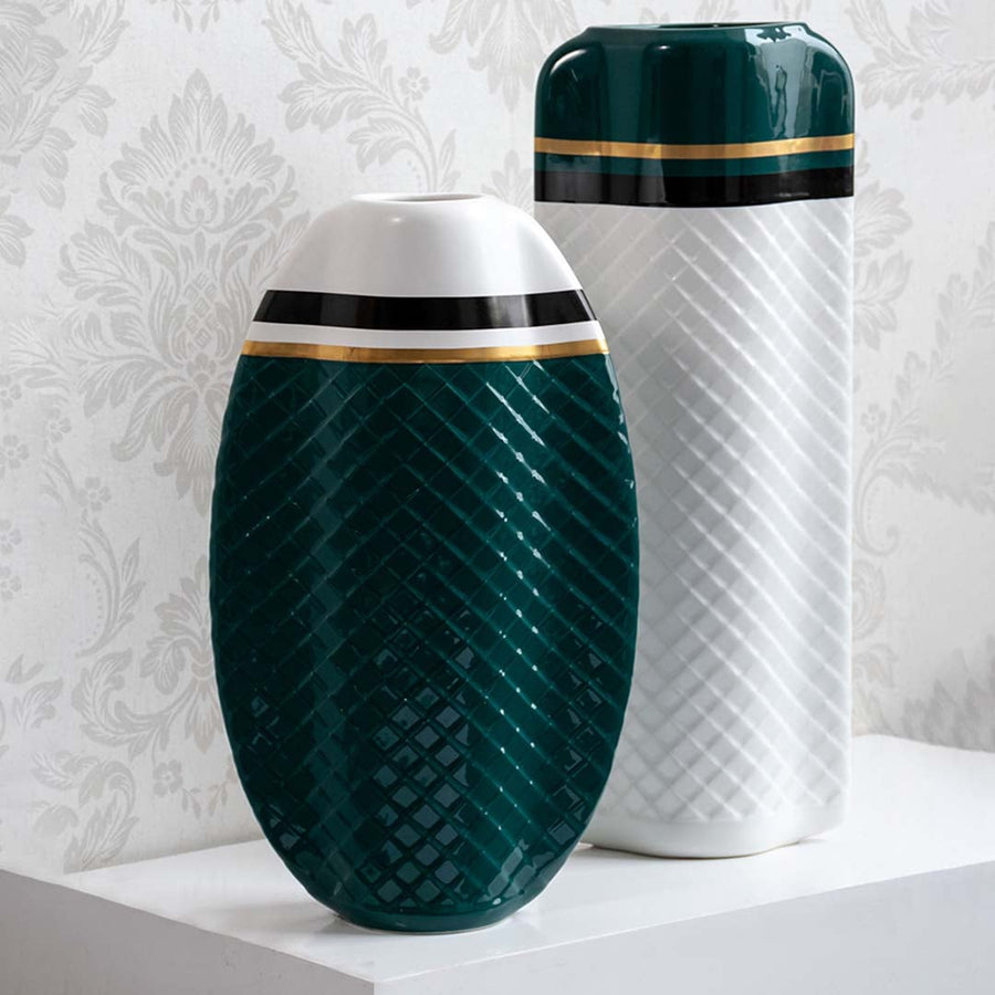 Pair of textured green and white geometric vases for modern luxury home decor and artistic tabletop display.
