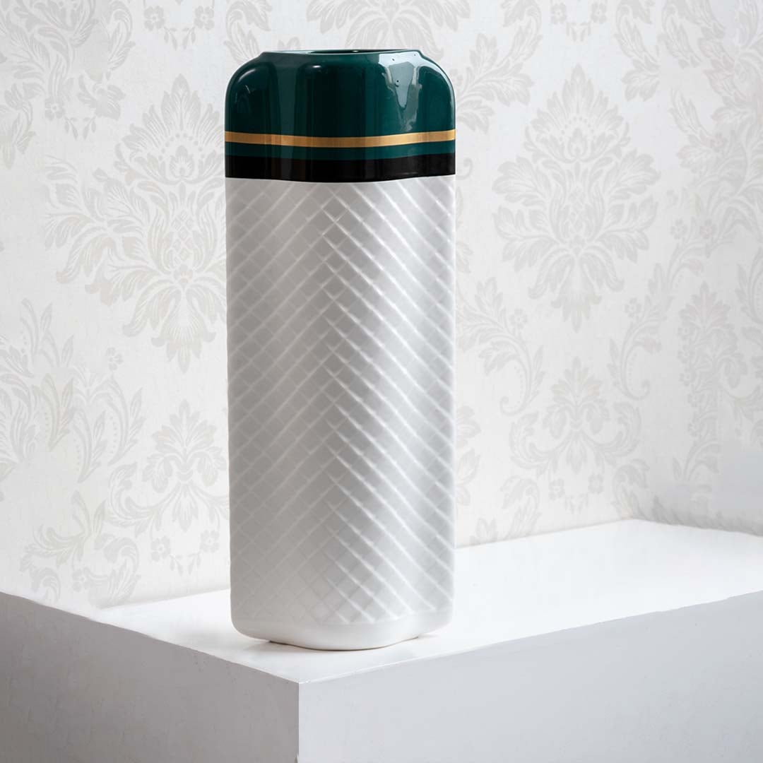 Textured white and green geometric vase for elegant modern home decor and sophisticated shelf accent style.