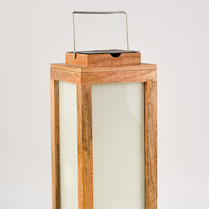 Wooden lantern with natural wood finish and frosted glass panels for elegant tabletop decor styling.
