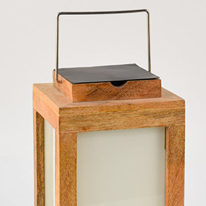 Closeup view of wooden solar lantern showing smooth natural wood texture frosted glass and detailed metal solar top finish.