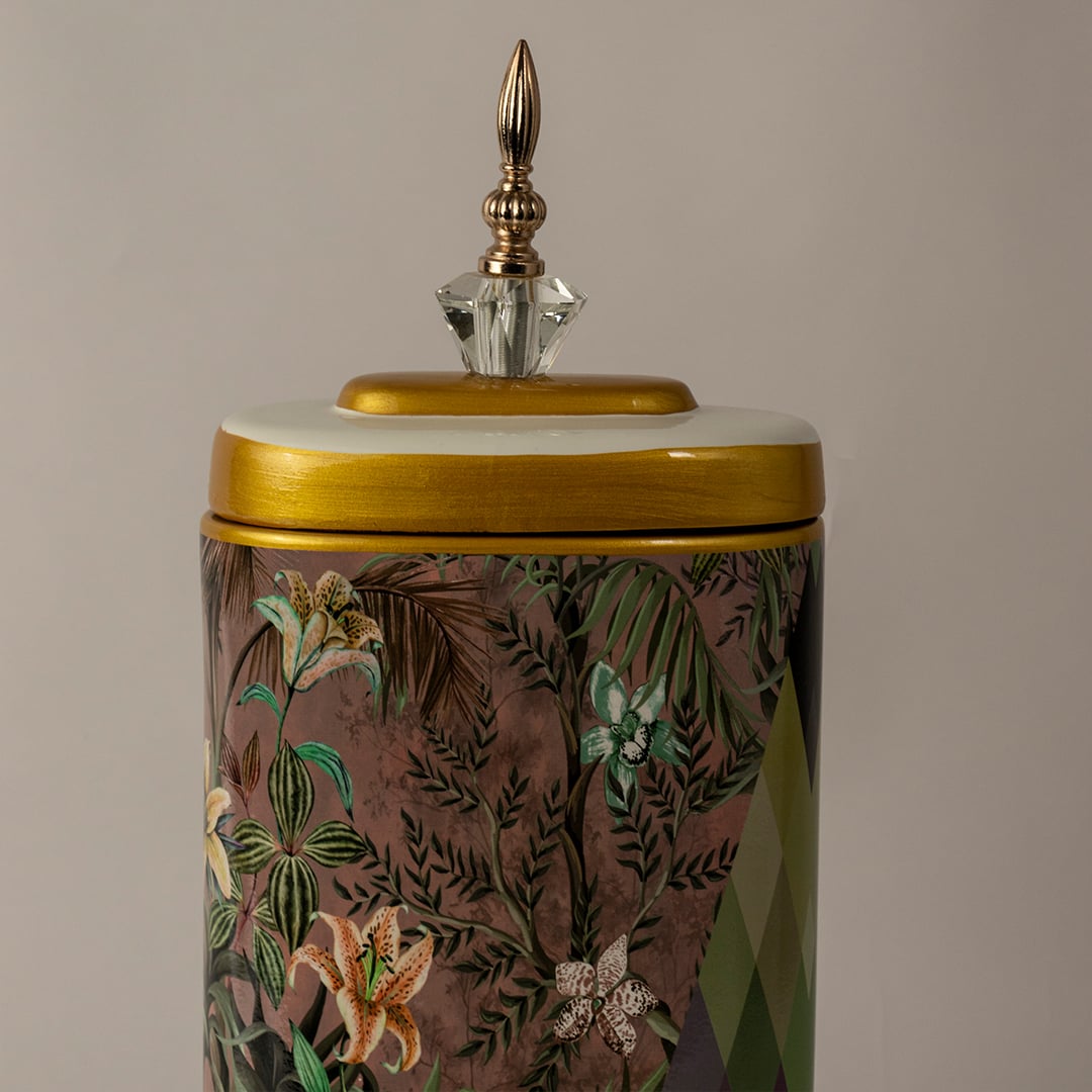 Closeup of Botanical Bloom tall ceramic jar showing detailed botanical painting and gold accent finish on the lid.