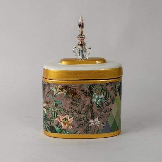 Decorative ceramic jar with multicolor botanical artwork and gold lid placed on white surface against neutral background showcasing premium artistic home decor accent.