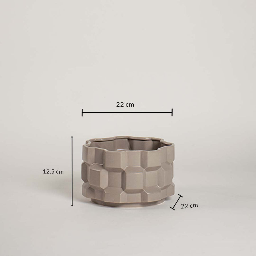 Taupe geometric ceramic planter with height and width measurements shown clearly for easy size understanding.