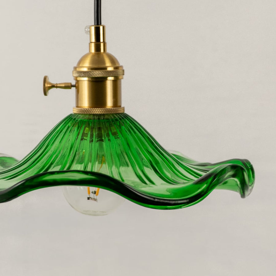 Green textured glass pendant light closeup highlighting artisanal detailing and premium decorative lighting craftsmanship.