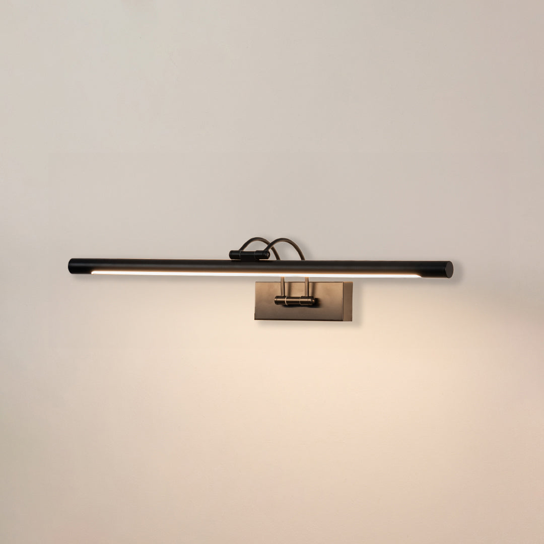 Minimal wall light in black metal finish with linear bar design for bathroom or vanity decor lighting white background.