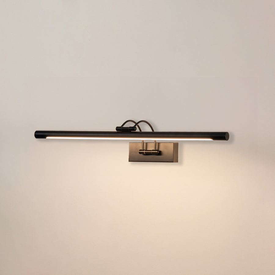Minimal wall light in black metal finish with linear bar design for bathroom or vanity decor lighting white background.
