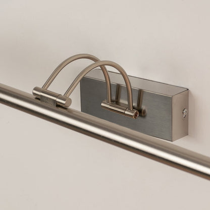 Closeup view of modern metal picture light with slim adjustable bar for focused wall illumination.