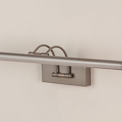 Closeup of sleek silver picture light showing its smooth metal finish and adjustable arm for precise wall illumination.