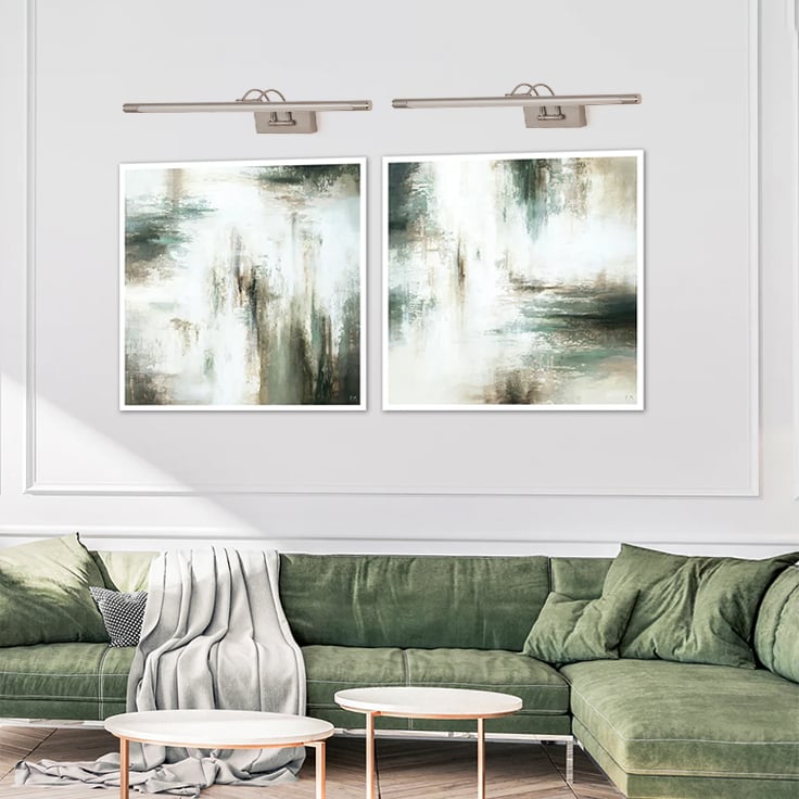 Elegant silver picture light offering focused wall illumination for modern living room or hallway decor with adjustable arm.
