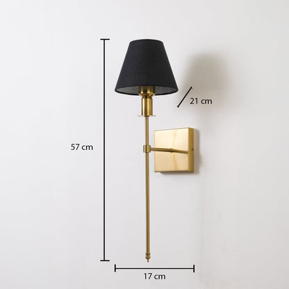 Gold wall sconce with black shade shown with 57 cm height 17 cm width and 21 cm depth for accurate placement.