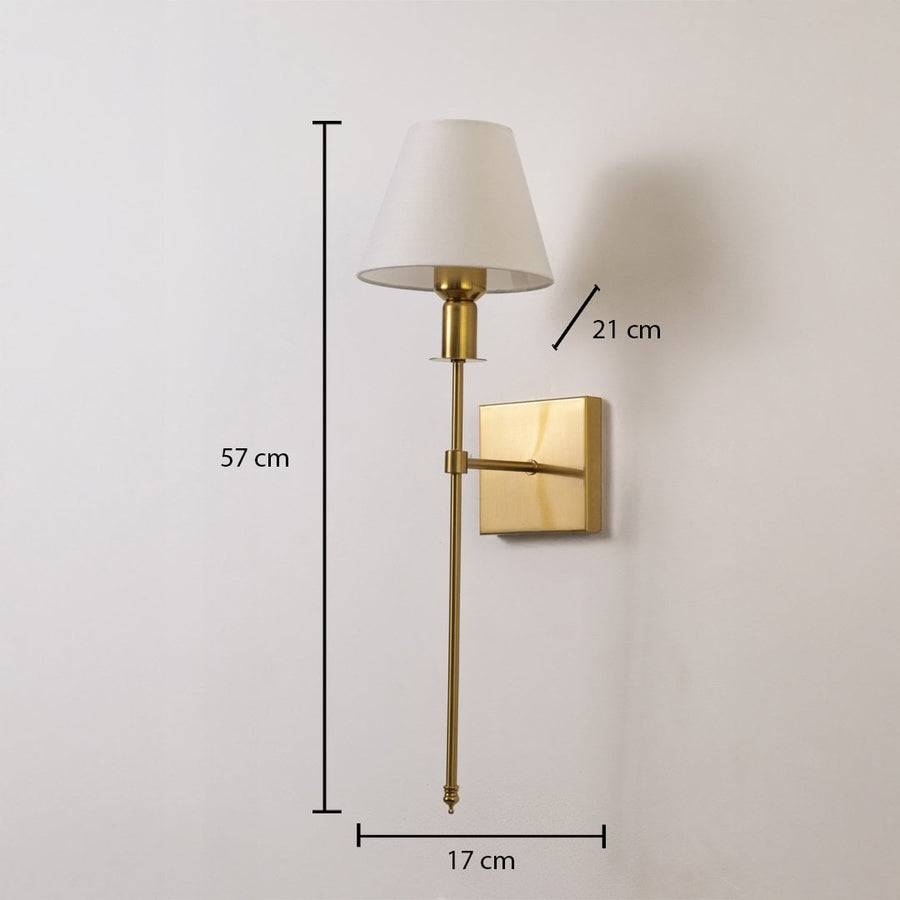 Gold wall sconce with white shade shown with 57 cm height 17 cm width and 21 cm depth for accurate placement.
