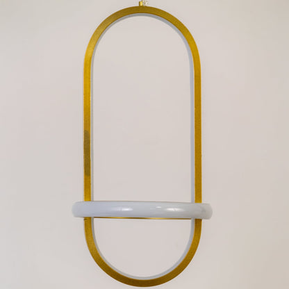 Closeup of gold and white metal oval hanging light showing smooth finish and premium modern design detailing.