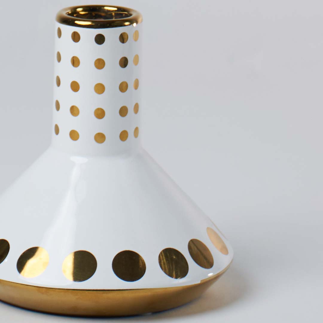 White ceramic decorative vase closeup with gold dotted detailing and metallic rim highlighting elegant finish for tabletop home decor.