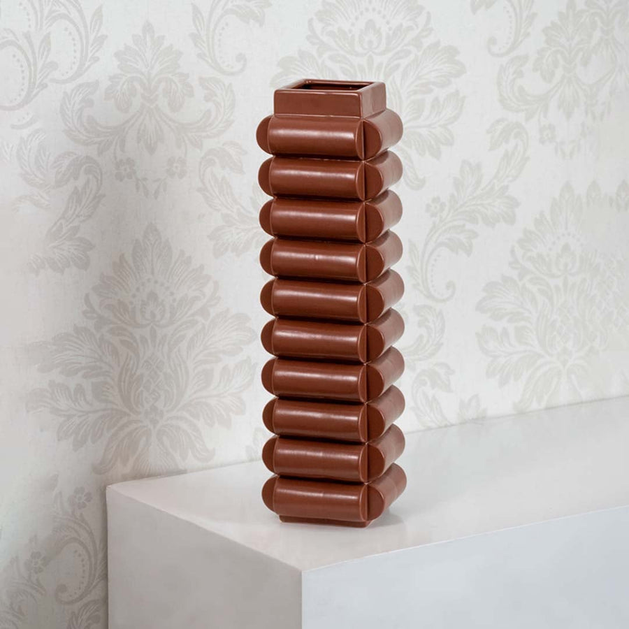 Brown ceramic designer vase with unique stacked pattern for stylish home table and shelf decoration.