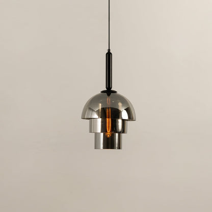 Chrome pendant light with a polished dome shade reflecting its surroundings while casting a warm downward glow that adds a sleek contemporary touch to the interior.