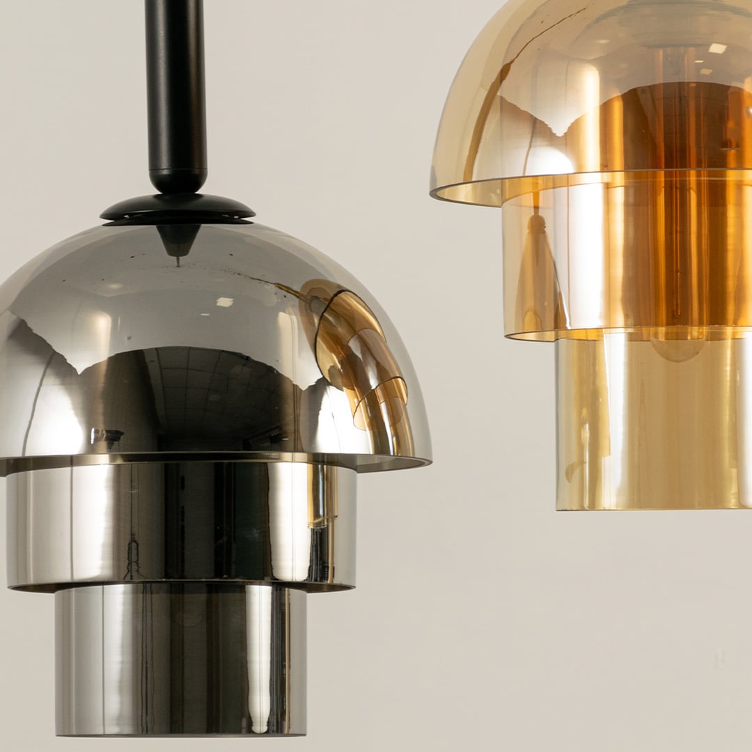 Reflective layered dome pendant in chrome and gold finish offering a stylish modern lighting feature ideal for elegant interior design environments.