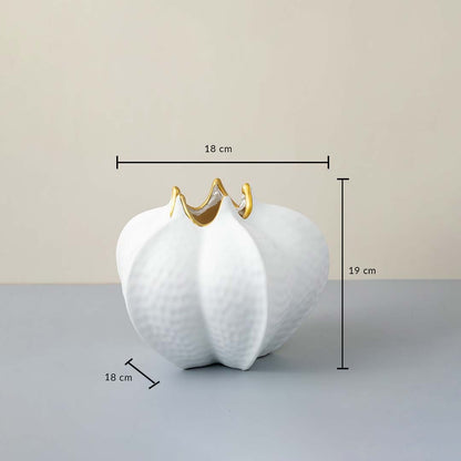 White ceramic vase with gold rim 19 cm height and 18 cm width ideal for table decor and stylish interiors.