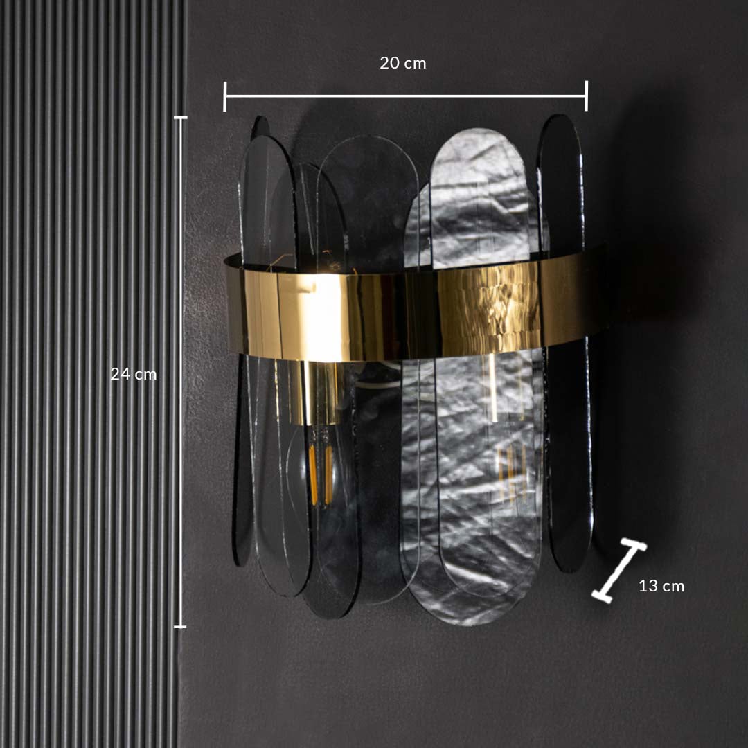 A metal and smoked glass wall light displayed with 20 cm width 24 cm height and 13 cm depth measurements highlighting its compact modern size.