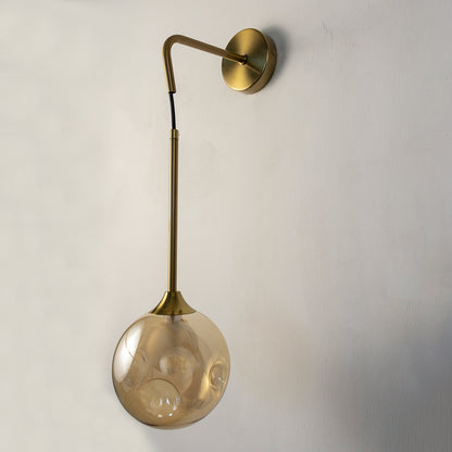 Modern gold metal hanging wall light with smoked glass shade for elegant bedroom and luxury hallway decor spaces.