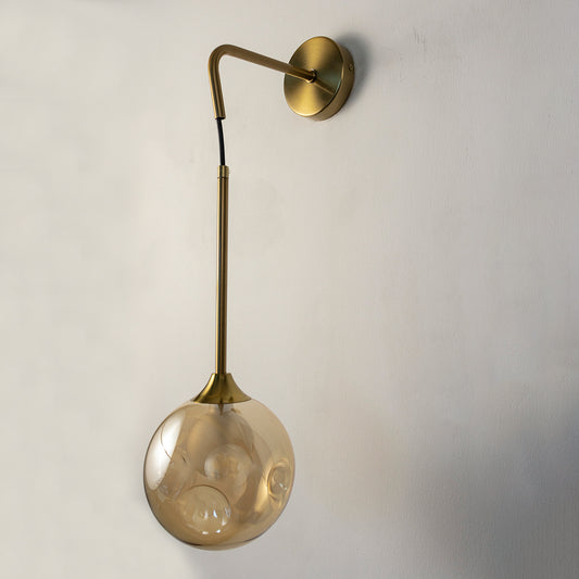 Modern gold metal hanging wall light with smoked glass shade for elegant bedroom and luxury hallway decor spaces.
