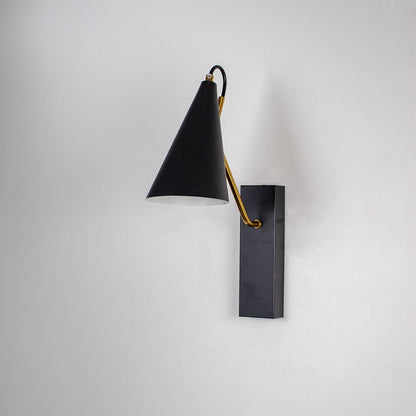 Contemporary black wall light with golden arm and sleek conical shade displayed off on black background for interiors.