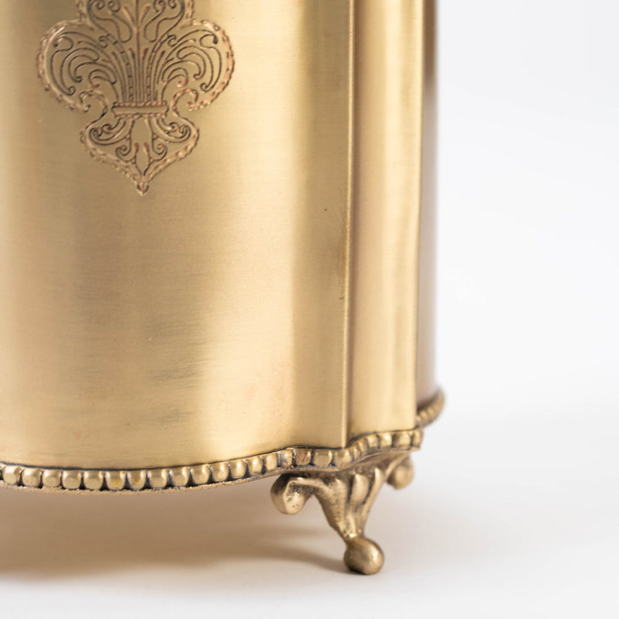 Detailed closeup of the brass fruit holder showing its engraved floral motif and ornate footed base captured on a white background with a clear focus on craftsmanship.