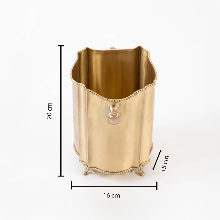 Brass container with 20 cm height 16 cm width and 14 cm depth shown with engraved design and scalloped edges.