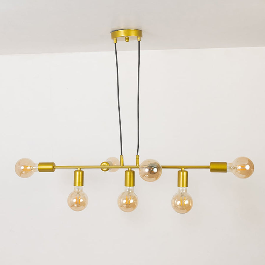 Modern linear chandelier with gold metal frame and exposed bulbs shown unlit on off white background for contemporary ceiling lighting.