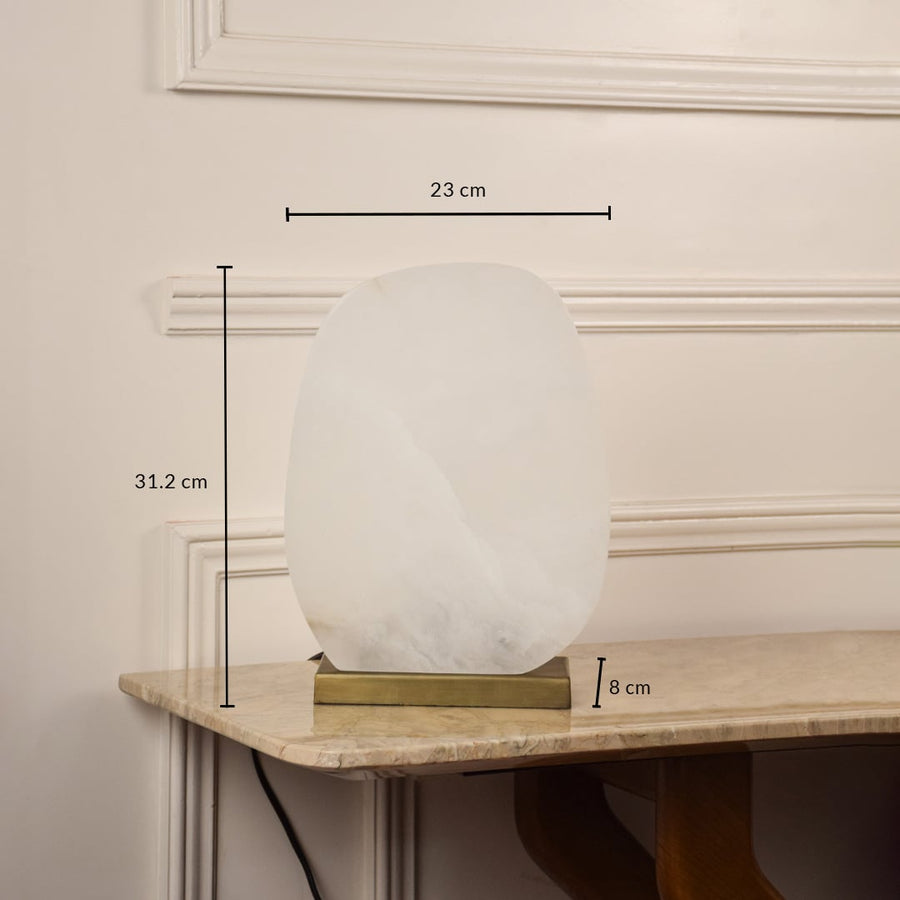 Table lamp with white glass globe and gold metal base showing 28 cm height and 20 cm width for bedside or console placement.