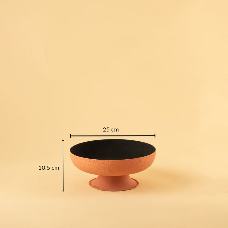 Terracotta textured metal pedestal bowl shown with 25 cm width and 10.5 cm height offering a clear accurate size reference.