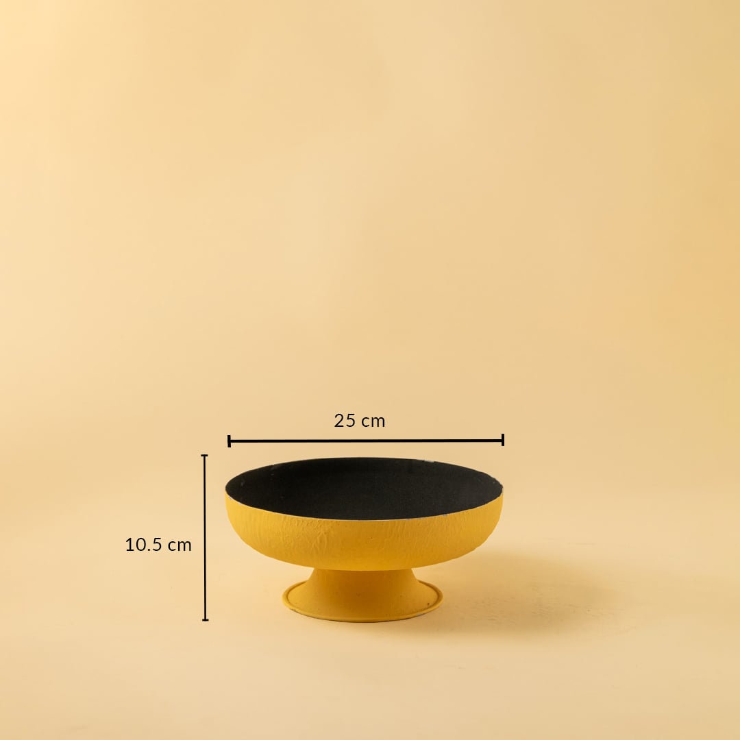 Yellow textured metal pedestal bowl shown with 25 cm width and 10.5 cm height offering a clear accurate size reference.