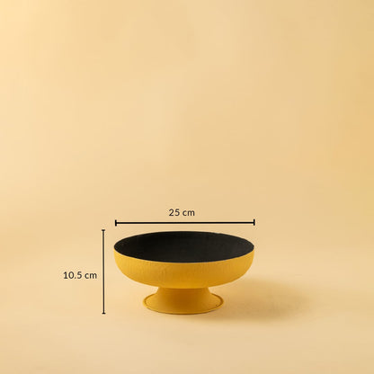 Yellow textured metal pedestal bowl shown with 25 cm width and 10.5 cm height offering a clear accurate size reference.