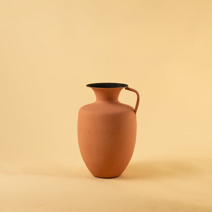 Terracotta metal jug vase decor on a clean white background highlighting its warm textured finish for versatile home styling.