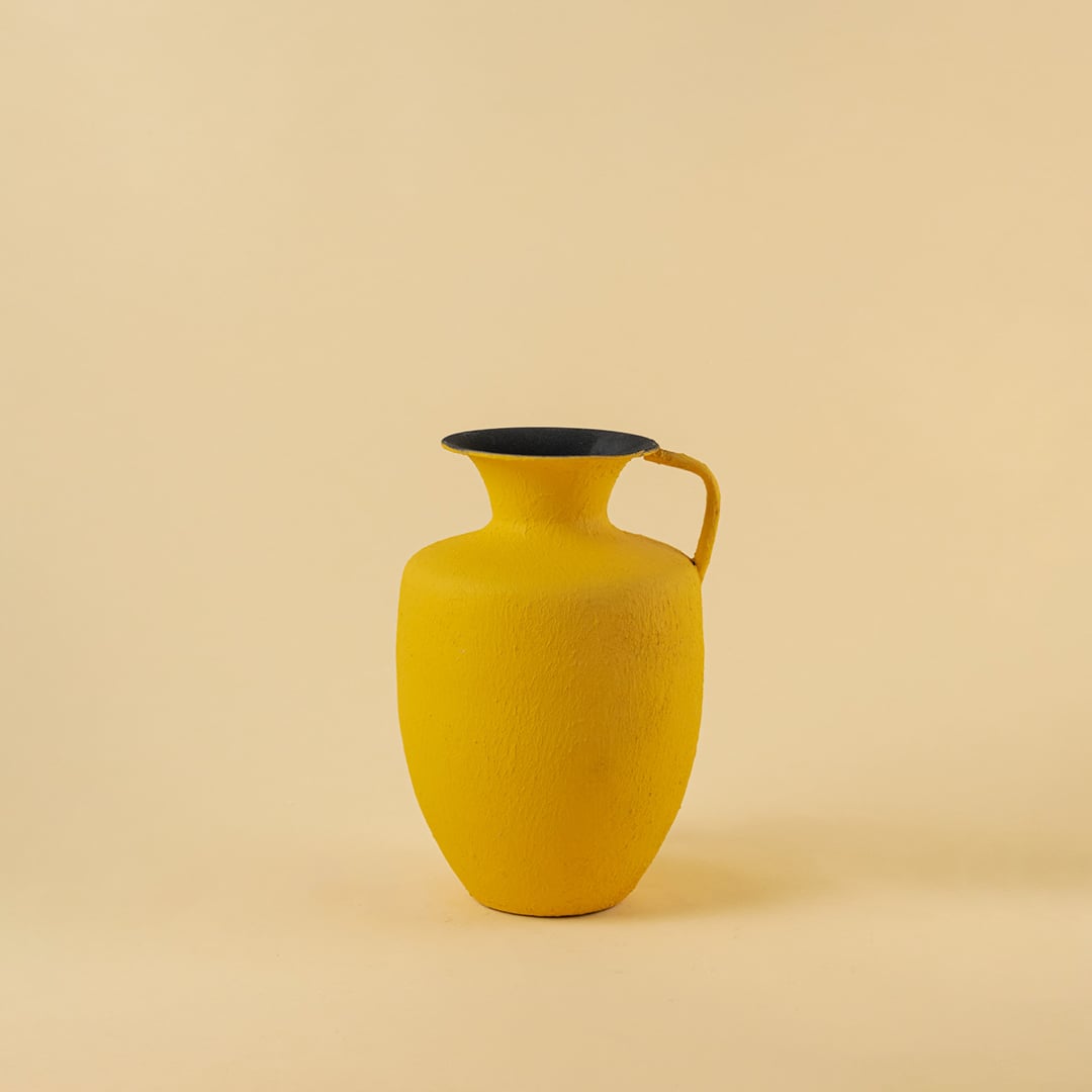 Yellow metal jug vase decor on a clean white background highlighting its bright textured finish for versatile home styling.