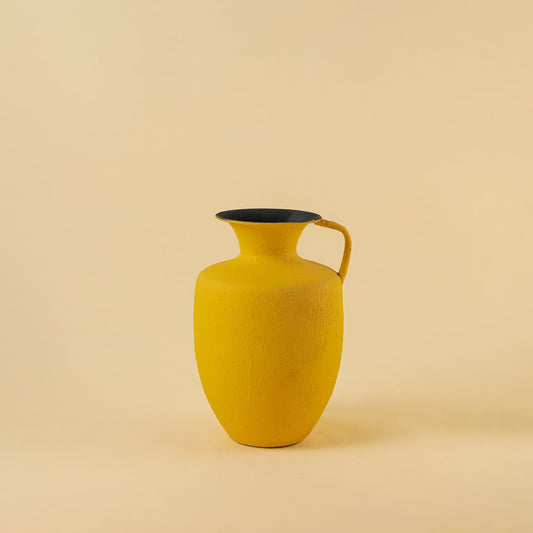 Yellow metal jug vase decor on a clean white background highlighting its bright textured finish for versatile home styling.