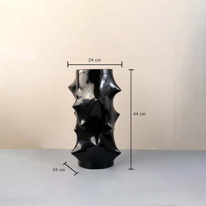 Black ceramic vase with glossy sculptural surface measuring 44 cm height and 24 cm width shown with dimension markings.