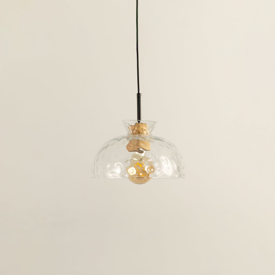 Clear artistic glass and brass metal pendant light with vintage charm for refined home interiors.