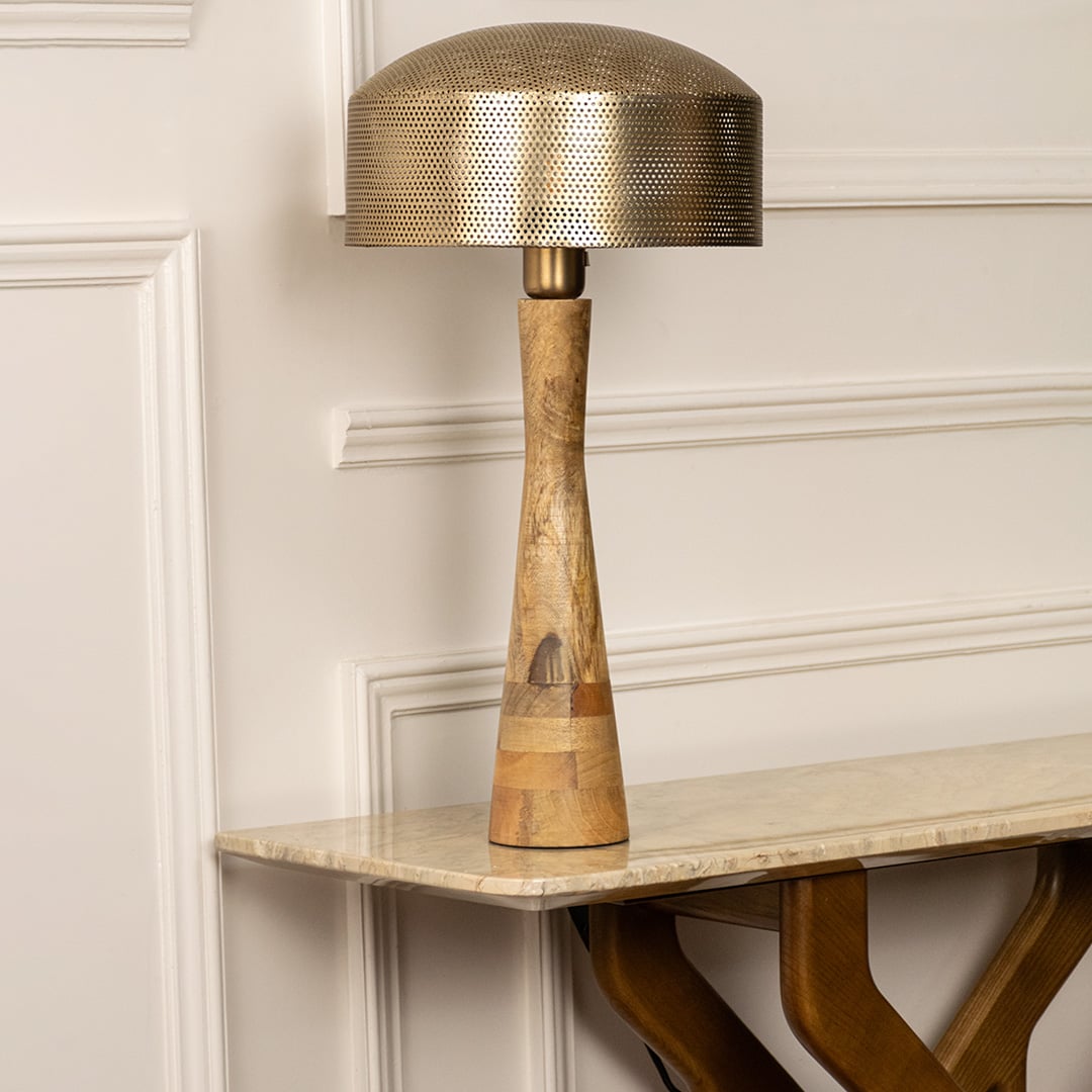 Wooden and metal table lamp with a sculpted design and golden shade that remains visually striking even when unlit perfect for luxury interiors.