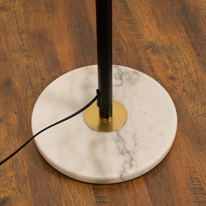Closeup of globe floor lamp with white frosted glass globes and gold accents.