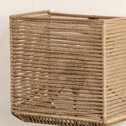 Detailed closeup of jute wall lamp showcasing its fine woven texture and expert craftsmanship that adds depth and organic appeal.