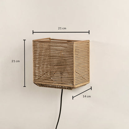 Handwoven jute wall light measuring 21 x 21 x 14 cm combines rustic charm with modern design perfect for ambient lighting.