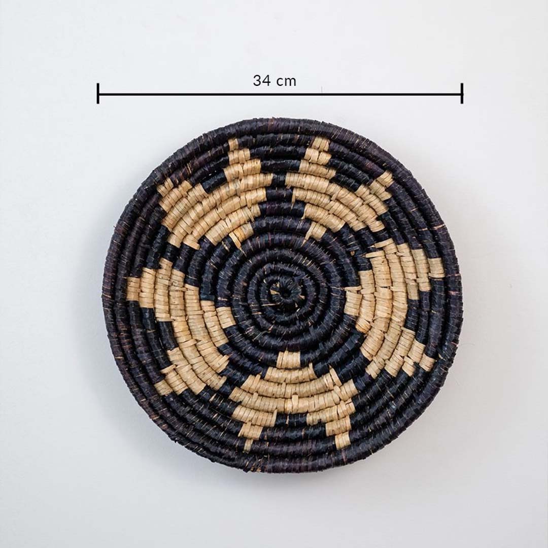 Handmade wicker basket wall art in black and beige star pattern with 34 cm diameter for modern interiors.