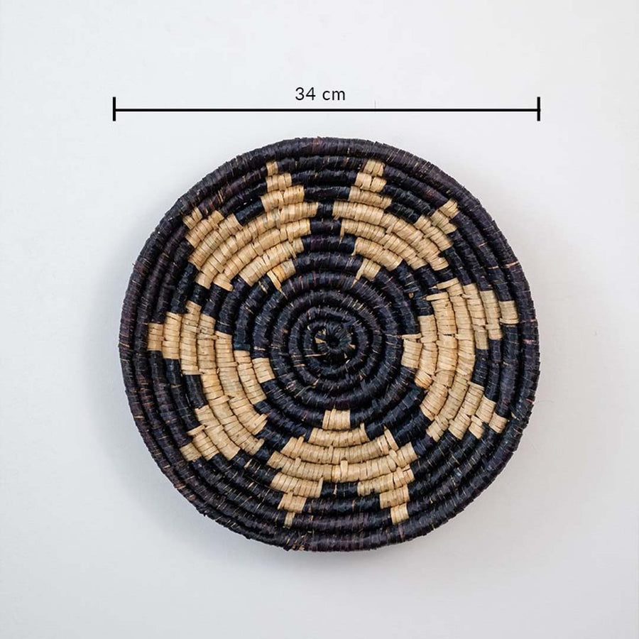 Handmade wicker basket wall art in black and beige star pattern with 34 cm diameter for modern interiors.