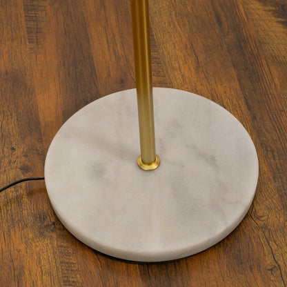Closeup of floor lamp showing the golden rod cylindrical shades and marble base for premium home lighting design.