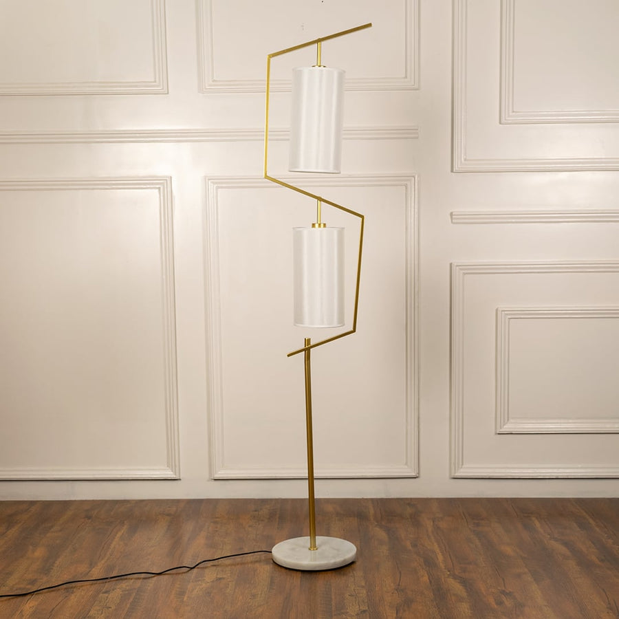 Floor lamp with gold stand and white shades presented light off against a clean white background for catalog display.