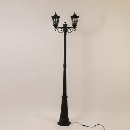 Vintage outdoor street lamp with triple lantern shades for elegant exterior decor styling use.