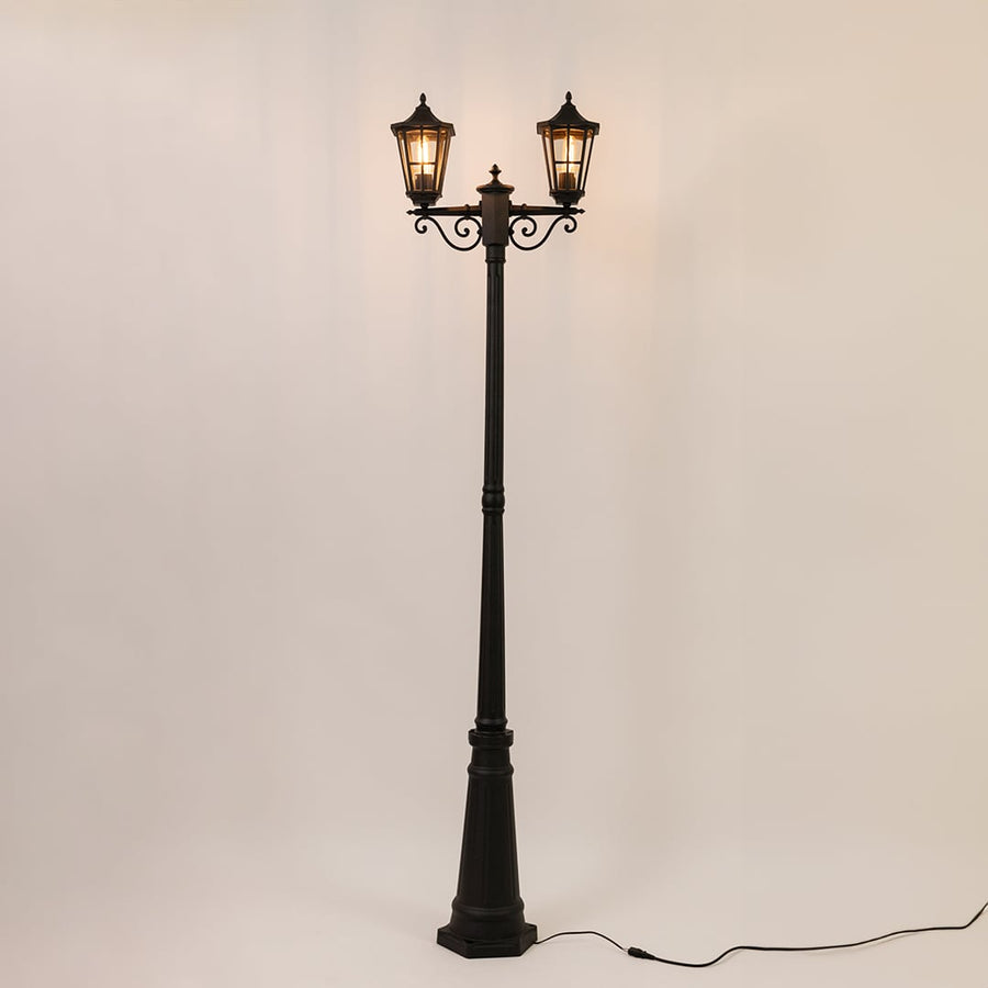 Decorative outdoor street lamp with dual glowing lanterns for elegant exterior decor use.