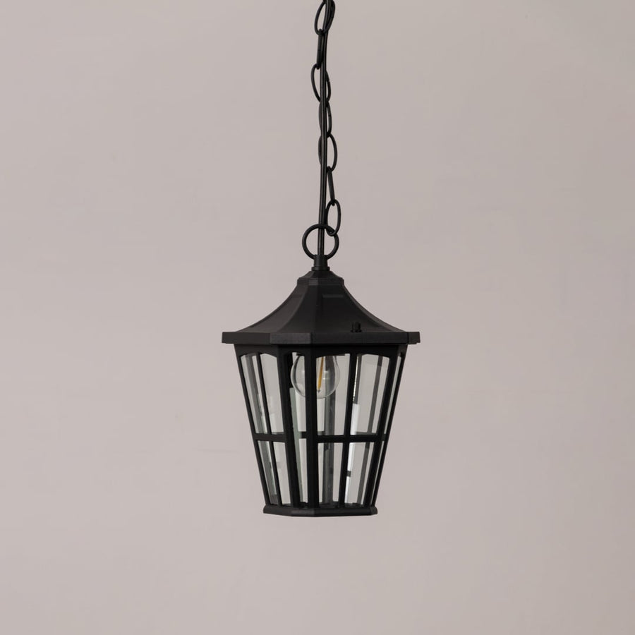 Stylish black outdoor hanging lantern with clear glass panels shown on white background perfect for porch and patio decor.