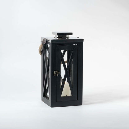 Modern black metal decorative lantern with cutout design shown on white background for table shelf and patio decor use.